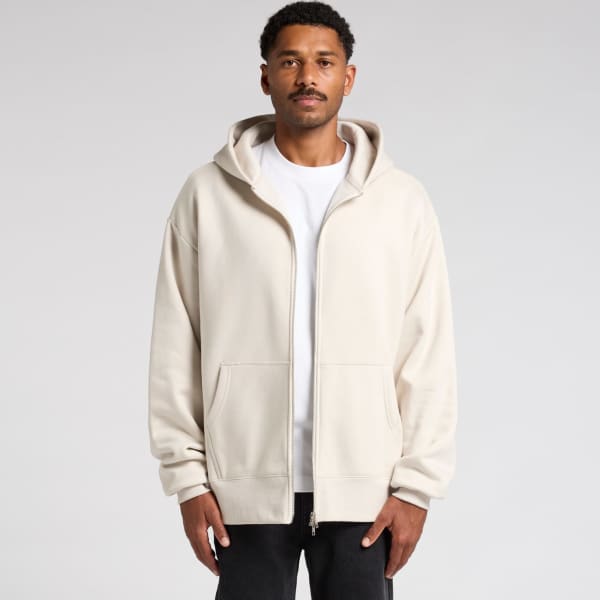 A heavy zip hoodie in a light beige colour, featuring a hood and a minimalistic design.