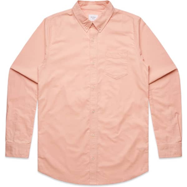 A button-up Oxford shirt in a soft peach colour with long sleeves and a chest pocket. Features a logo.