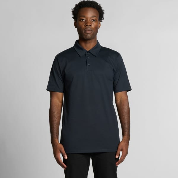 A dark navy polo shirt featuring a collar and a logo, displayed on a model.