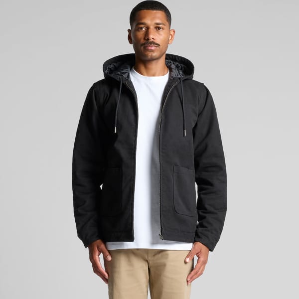 A black heavy hooded jacket with a zip, featuring a logo, worn by a model against a neutral background.