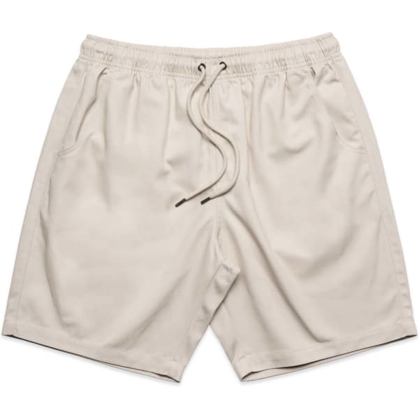 Light beige shorts with an elastic waistband, drawstring, and side pockets. Features a logo on the design.