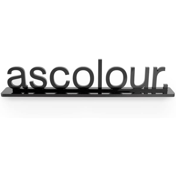 A black display stand featuring the word "ascolour" in bold lettering.