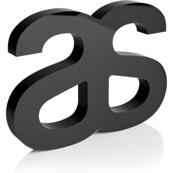 A black plaque featuring a stylised logo design, with a smooth, glossy finish.