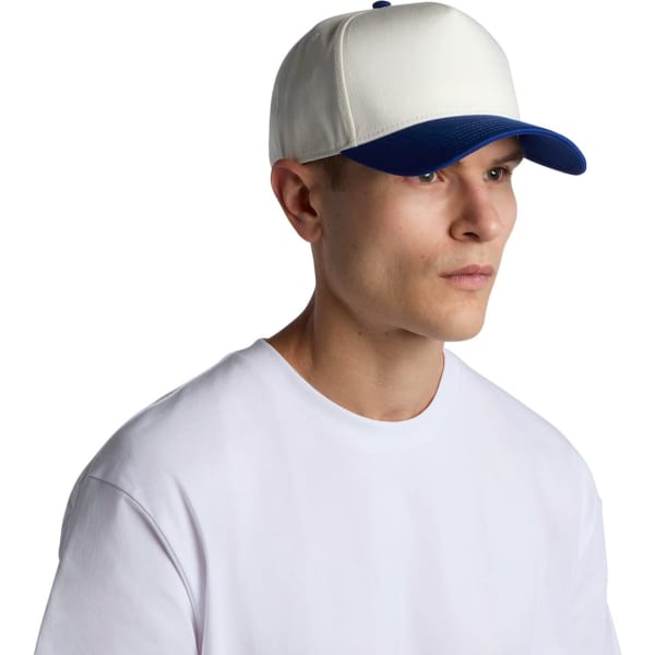 A two-tone cap featuring a white front and a blue brim, worn by a young man in a plain white t-shirt.