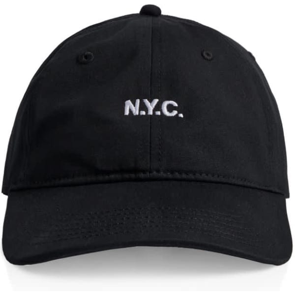 A black cap with a front logo and ventilation holes. Features a curved brim and adjustable strap at the back.