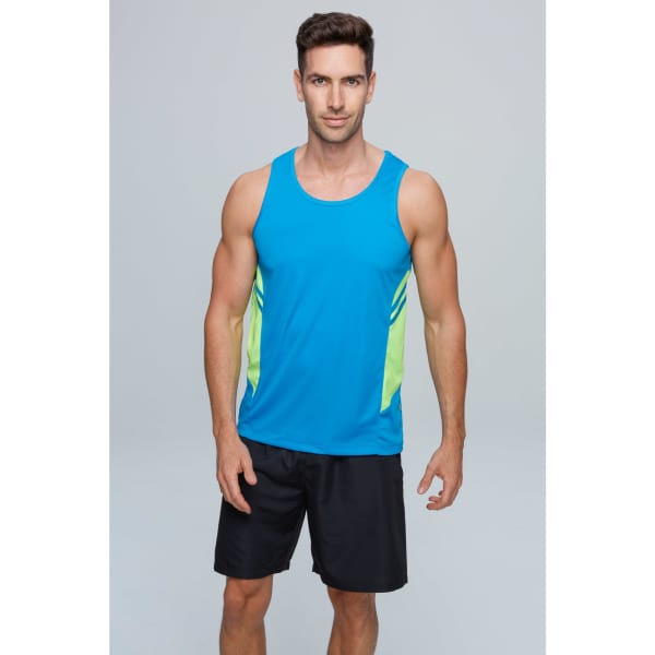 A man models a blue singlet with lime green side panels, paired with black shorts. The singlet has a logo.
