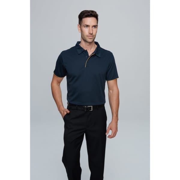 A navy polo shirt with contrasting yellow detailing, paired with black trousers. The model stands confidently with hands at his sides.