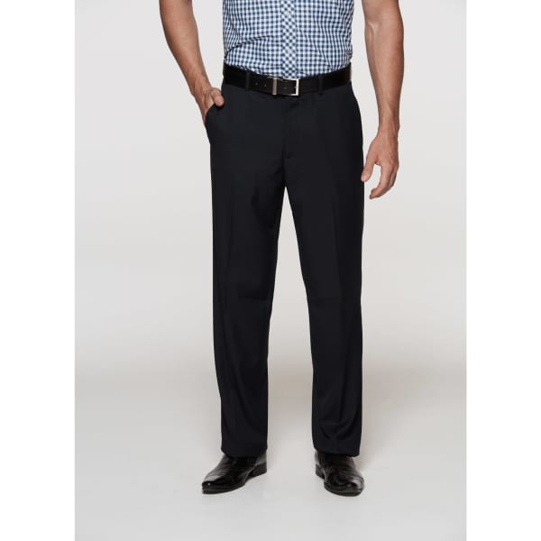 Men's flat front pants in black, paired with a checkered shirt and belt. The model stands with a neutral background.