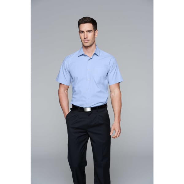 A short-sleeve button-up shirt in light blue, paired with black trousers. Features a logo.