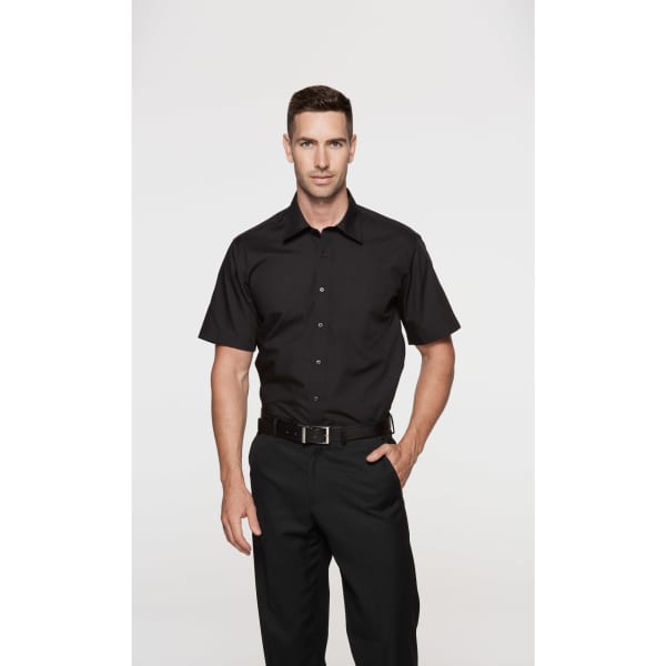 A black short-sleeve button-up shirt worn by a model, featuring a logo on the chest.