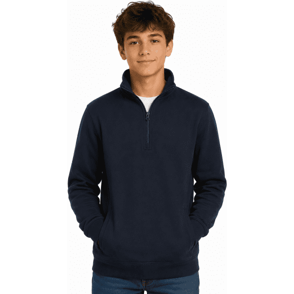 A navy 1/4 zip sweater for kids with a stand-up collar and a branding logo. The model stands with hands in pockets.