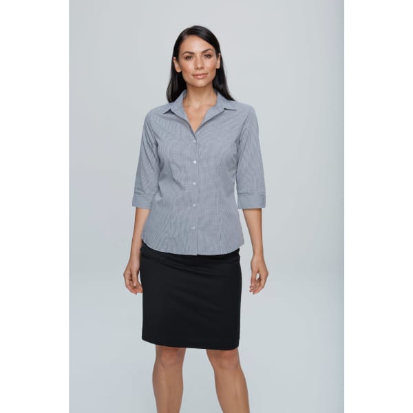 A button-up shirt in grey with a fitted style and 3/4 sleeves, paired with a black skirt. Features a logo.