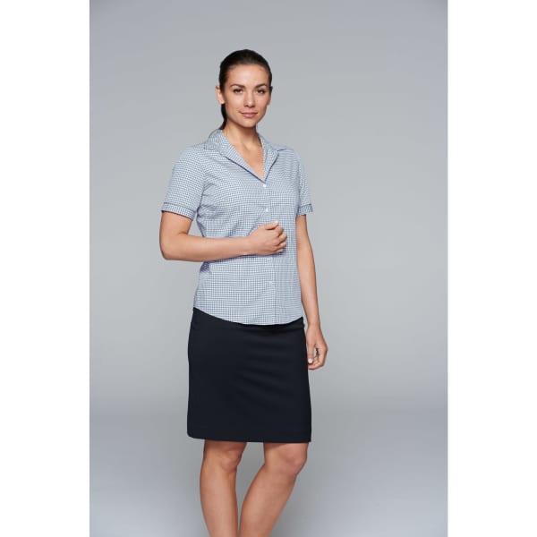 A short-sleeve button-up shirt in a checkered pattern, paired with a black skirt. Features a logo on the shirt.