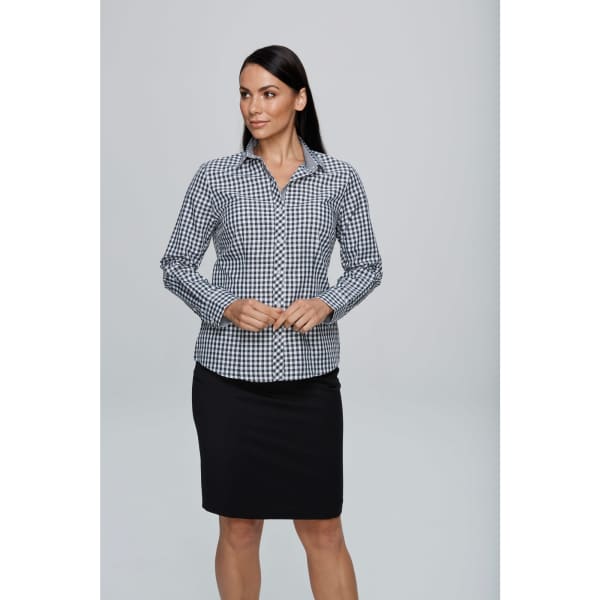 A long-sleeve button-up shirt in black and white gingham pattern, worn by a model with long hair and a black skirt.
