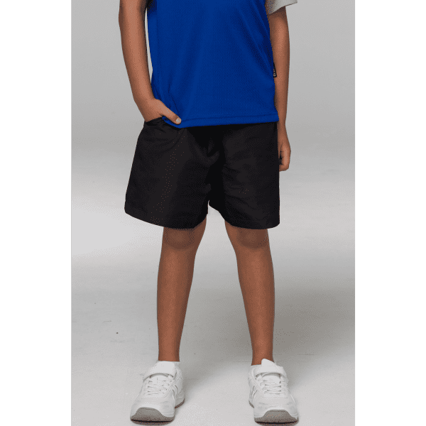Black sports shorts on a child, paired with a blue shirt and white sneakers. The shorts feature a logo.