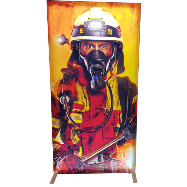 A light box featuring a firefighter in vibrant red and yellow uniform, equipped with safety gear and a helmet.