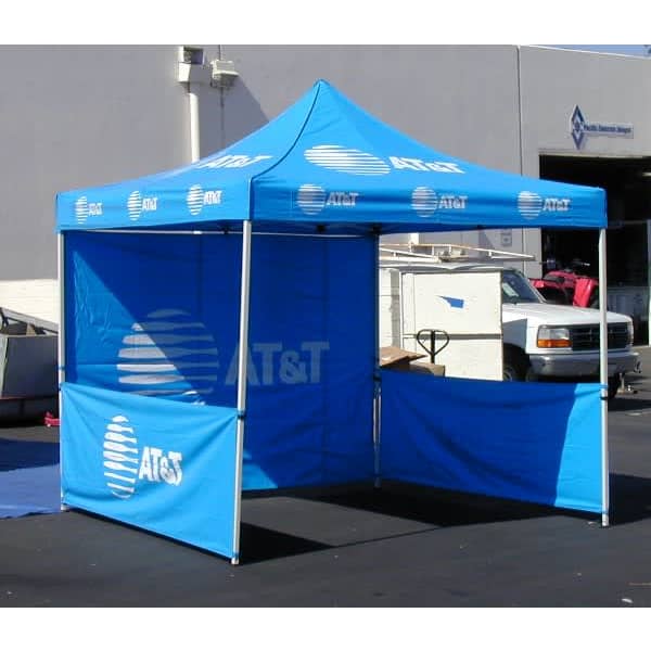 A blue promotional tent with white branding, featuring an open front and side panels.