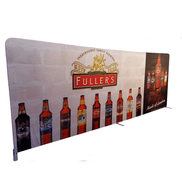 A tension fabric display with a straight frame, featuring various beer bottles and a logo, predominantly in white and brown.