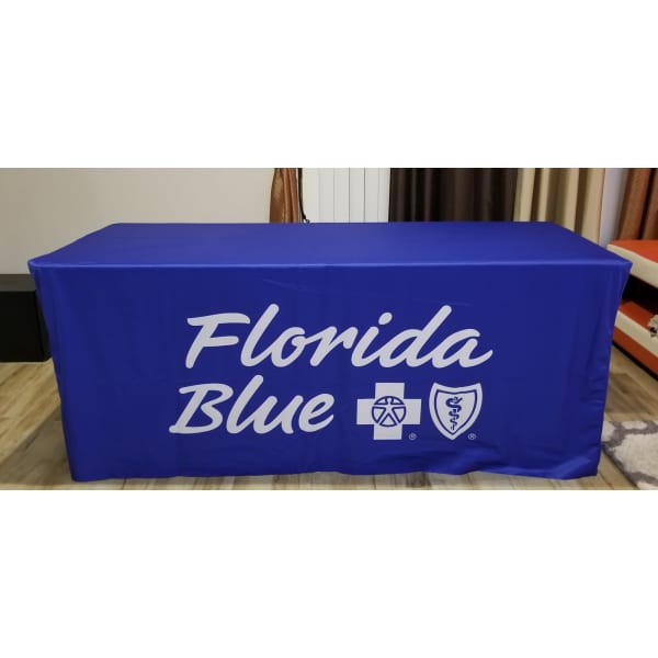 A fitted table cover in blue with a logo, designed for a 4-foot table.