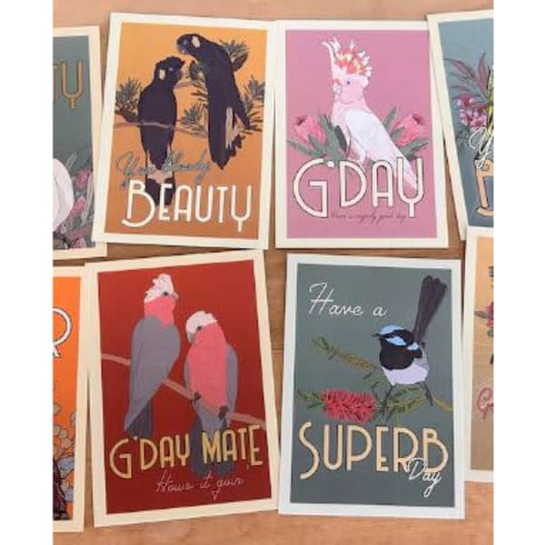 A collection of colourful postcards featuring Australian birds and floral designs, with a logo displayed.