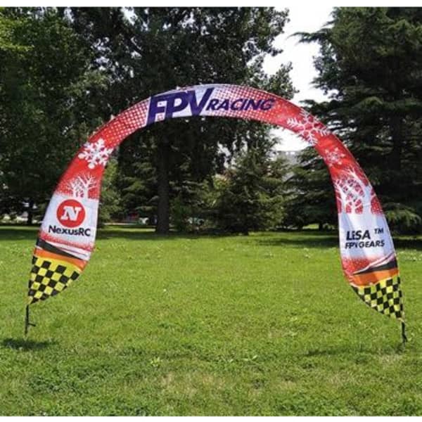A promotional arch banner featuring red and black colours, with a checkered border and a logo on each side.