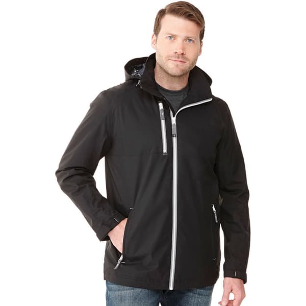 A man wearing a black rain jacket with a hood, featuring zippered pockets and a logo.