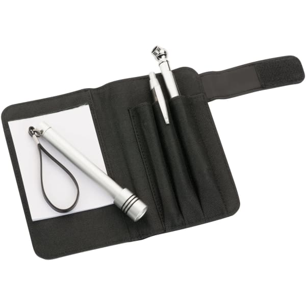 A black breakdown kit featuring a flashlight, two pens, a notepad, and a keyring, all stored in a compact case.