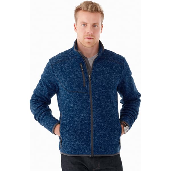 A men's knit jacket in navy blue with a zip front and side pockets, featuring a logo on the chest.