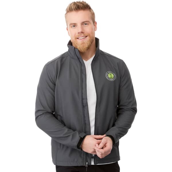 A men's softshell jacket in grey, featuring a logo, with a zip-up front and a high collar.