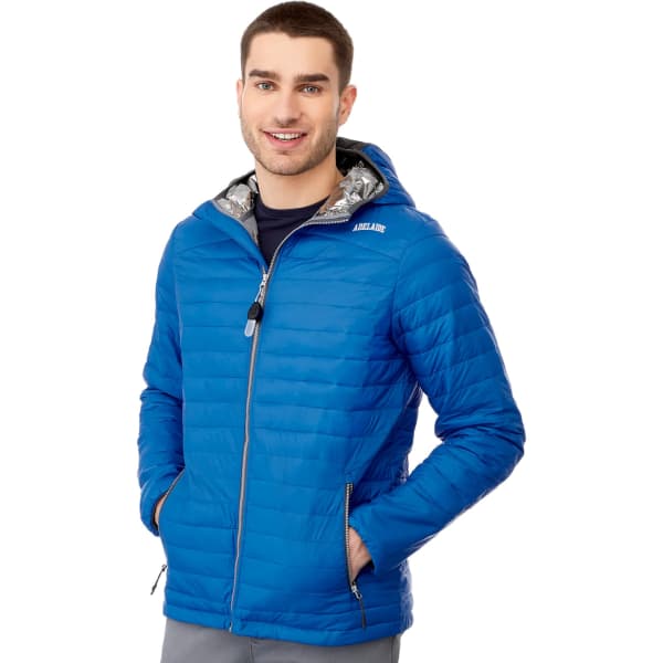 A blue insulated puffer jacket with a hood, featuring a patterned interior and zipped pockets. It has branding.