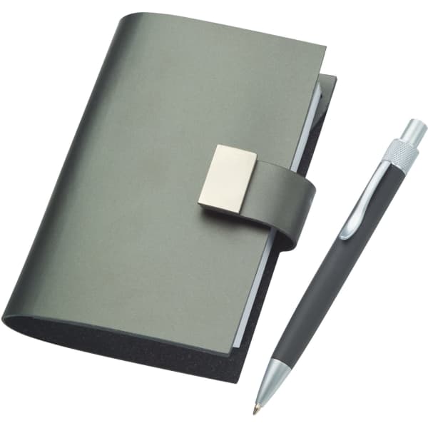 A dark green split leather jotter with a silver clasp, accompanied by a matching pen.