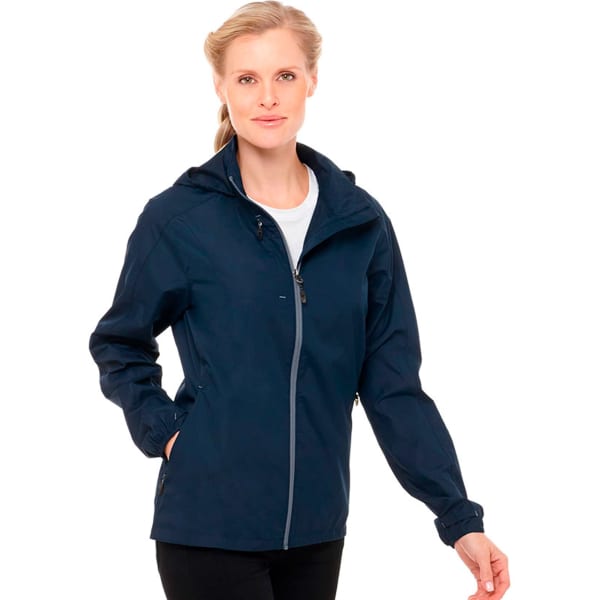 A woman is wearing a navy lightweight jacket with a hood, featuring a zippered front and a logo.