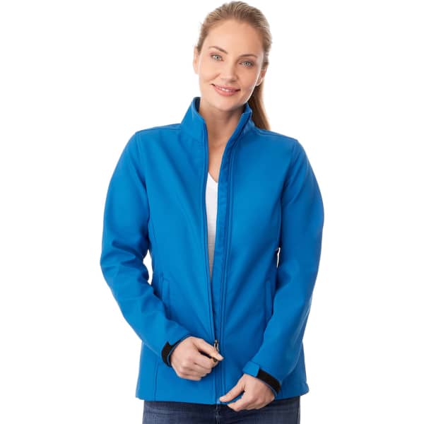 A blue women's softshell jacket with a zip front and a stand-up collar, featuring a logo.
