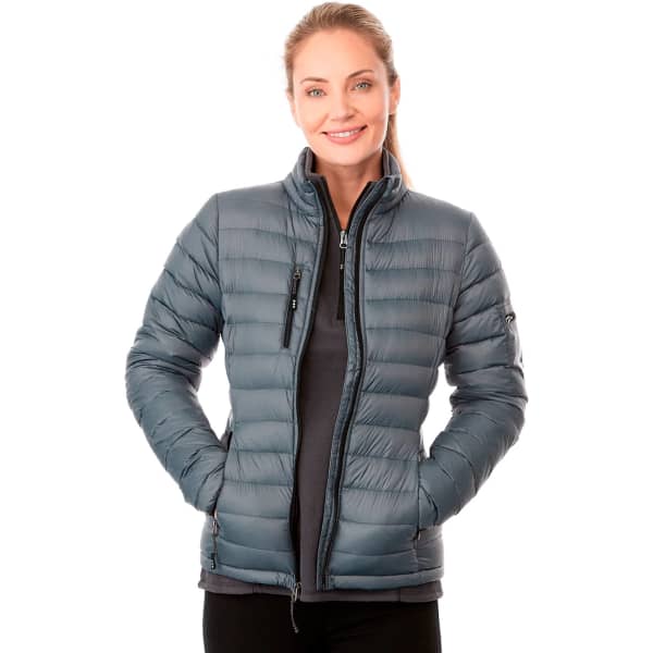 A women's puffer jacket in dark grey, featuring a zip front and a fitted design, with a logo on one sleeve.