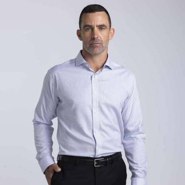 A men's check shirt in light blue and white, featuring a button-up design and a collar, displayed on a model.