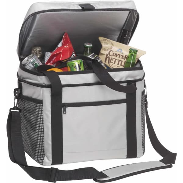 A grey cooler bag with a black strap, filled with drinks and snacks. It features a zipped pocket on the front and has branding.