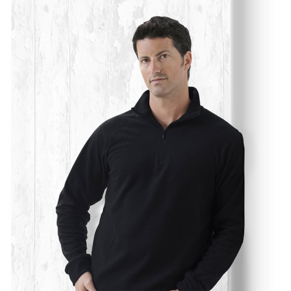 A black pullover sweater with a zippered collar, featuring a logo on the chest.