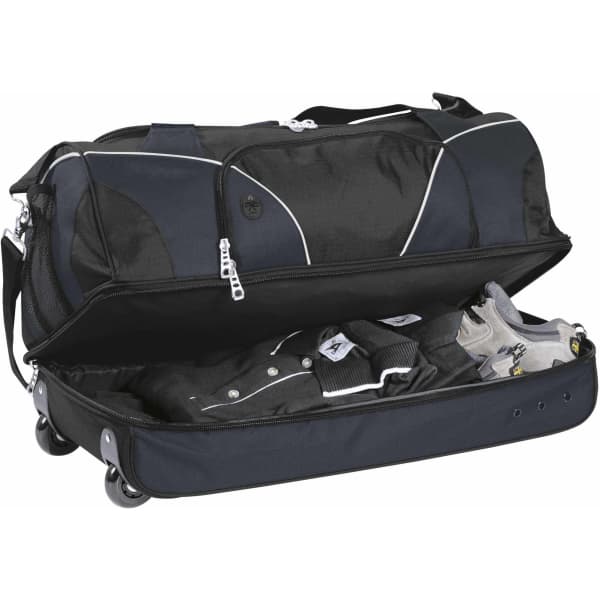A black wheeled travel bag opened to reveal neatly packed clothing, with a logo visible on the exterior.
