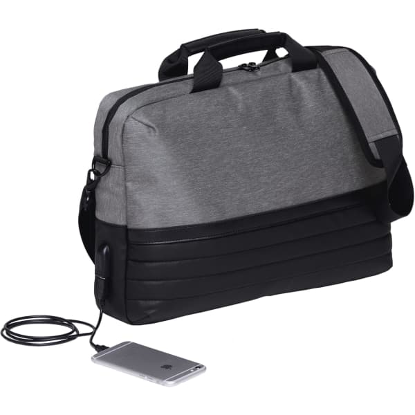 A grey and black laptop bag with a shoulder strap, featuring a charging port and a smartphone beside it.