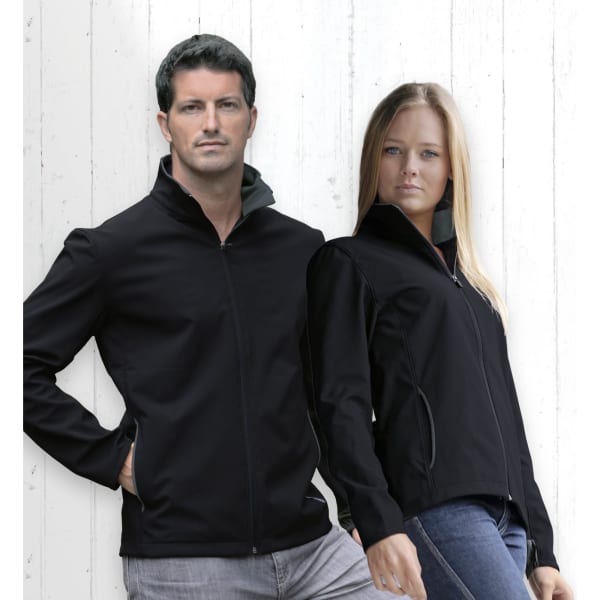 A black soft shell jacket is displayed on a man and woman, featuring a zip front and a logo on the chest.