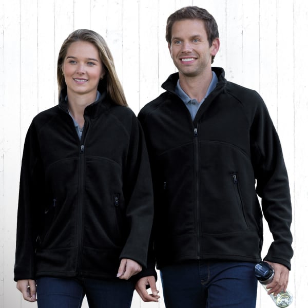 A black microfleece jacket is worn by a man and woman standing together, both smiling. The jackets have zippers and pockets.