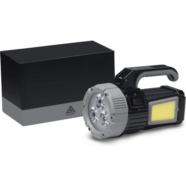 A black and silver torch with three bright LEDs, displayed next to a black box.