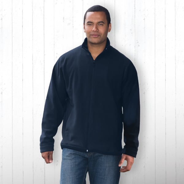 A man wearing a black polar fleece jacket with a zip front and long sleeves, featuring a logo.