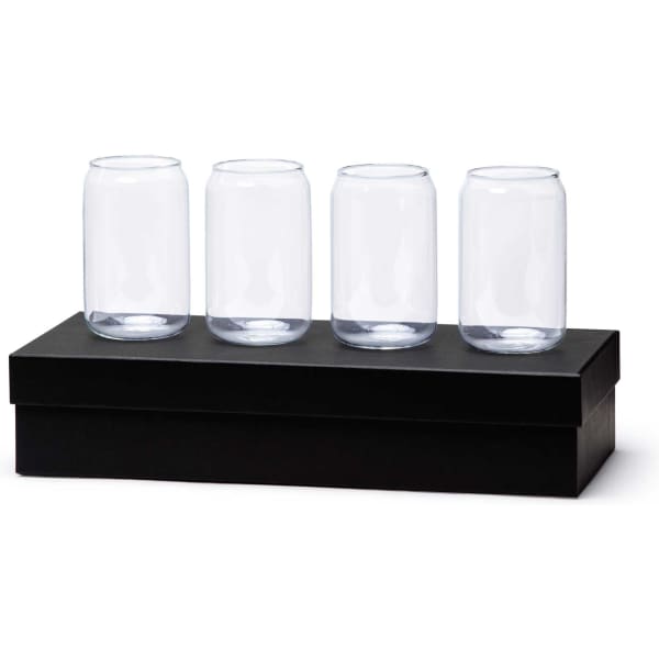 A set of four clear glass beer cans displayed on a black box. The glasses are identical in shape and size.