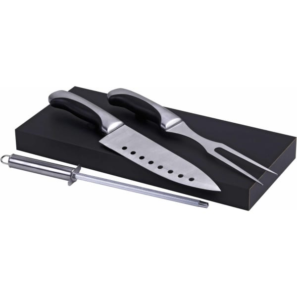A carving set with stainless steel knife, fork, and honing rod, featuring black handles and a sleek black block.