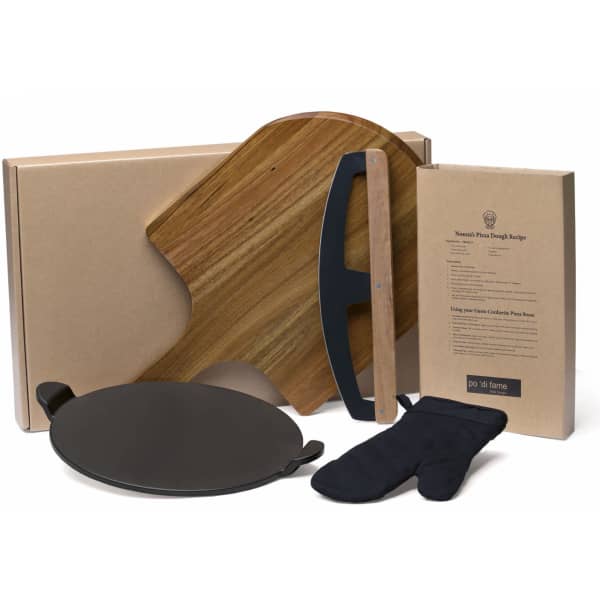A pizza set featuring a wooden peel, a black baking stone, an oven mitt, and packaging in neutral colours.