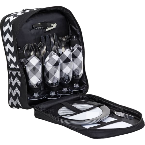 A picnic set in a black and white chevron backpack, featuring glasses, cutlery, and plates.