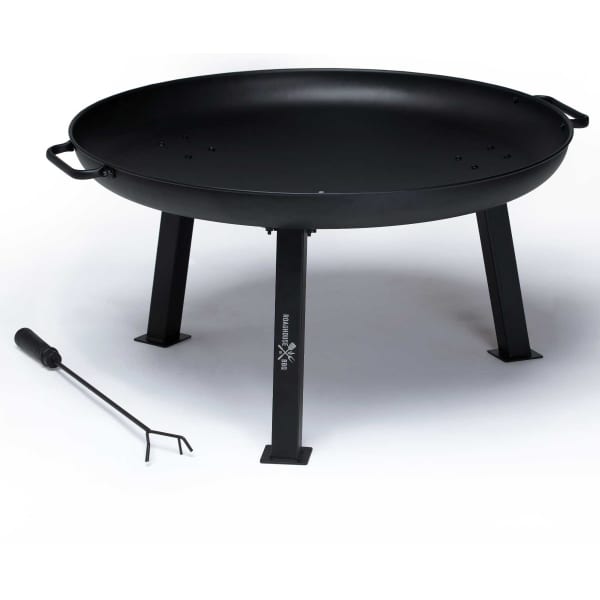 A black fire pit with a round bowl and sturdy legs, accompanied by a metal tool.