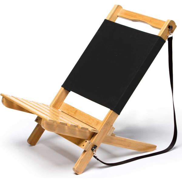 A black adjustable beach chair made of bamboo with a handle and shoulder strap for easy carrying.