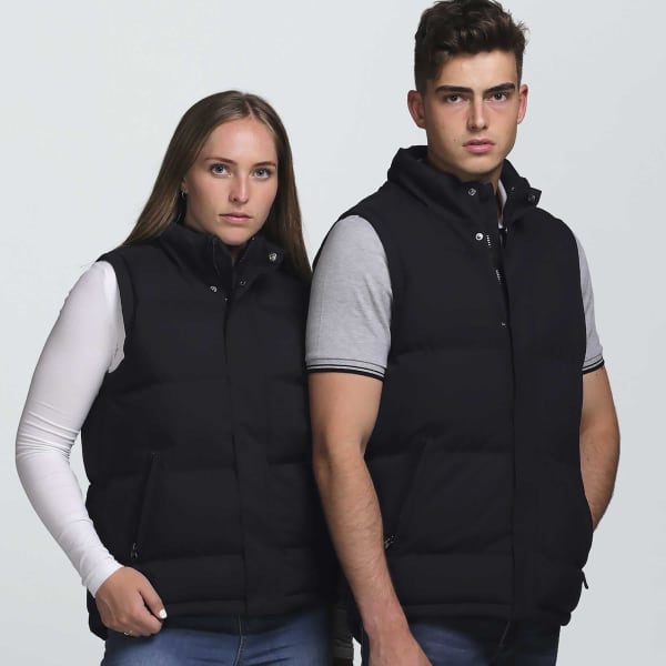 A black puffa vest displayed on two models, featuring a zip design and side pockets.